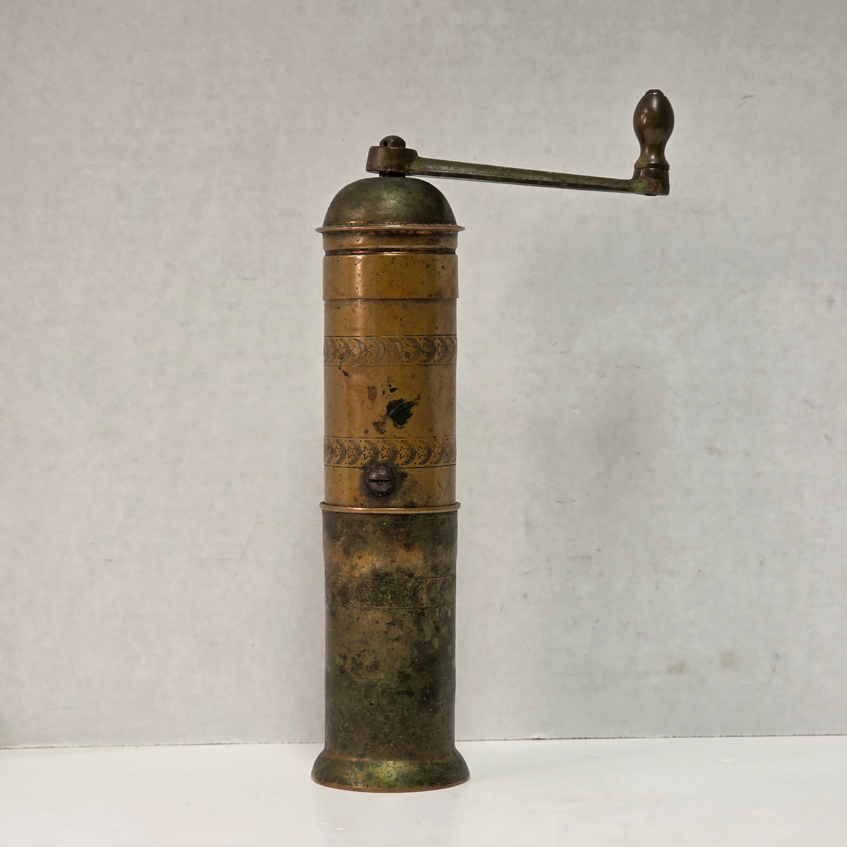 Nine-inch primitive antique hand-crank pepper grinder