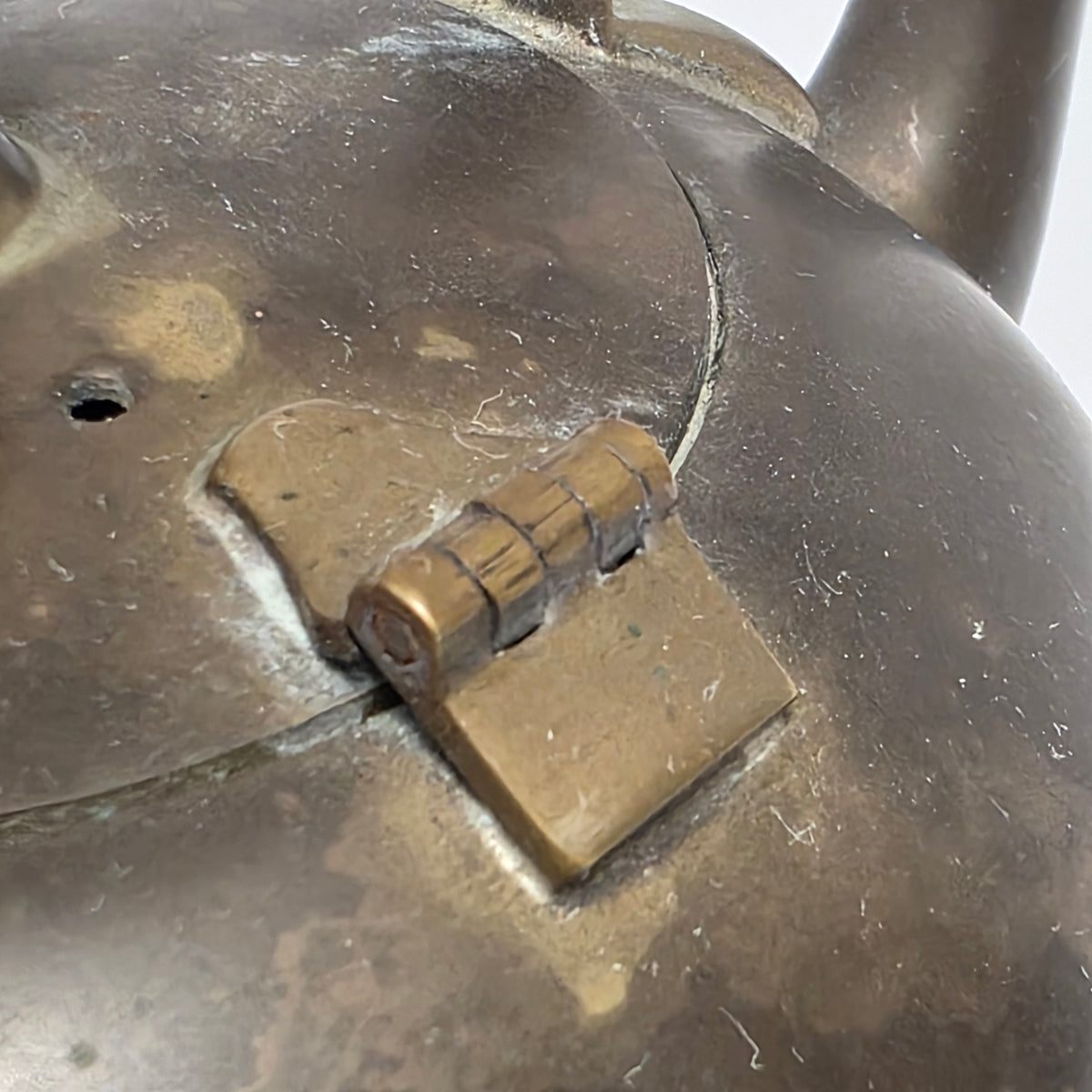 Dainty primitive brass teapot with rattan handle
