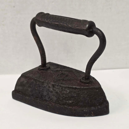 Antique Taylor Forbes No. 6 cast iron sad iron with diamond marking and patterned handle.
