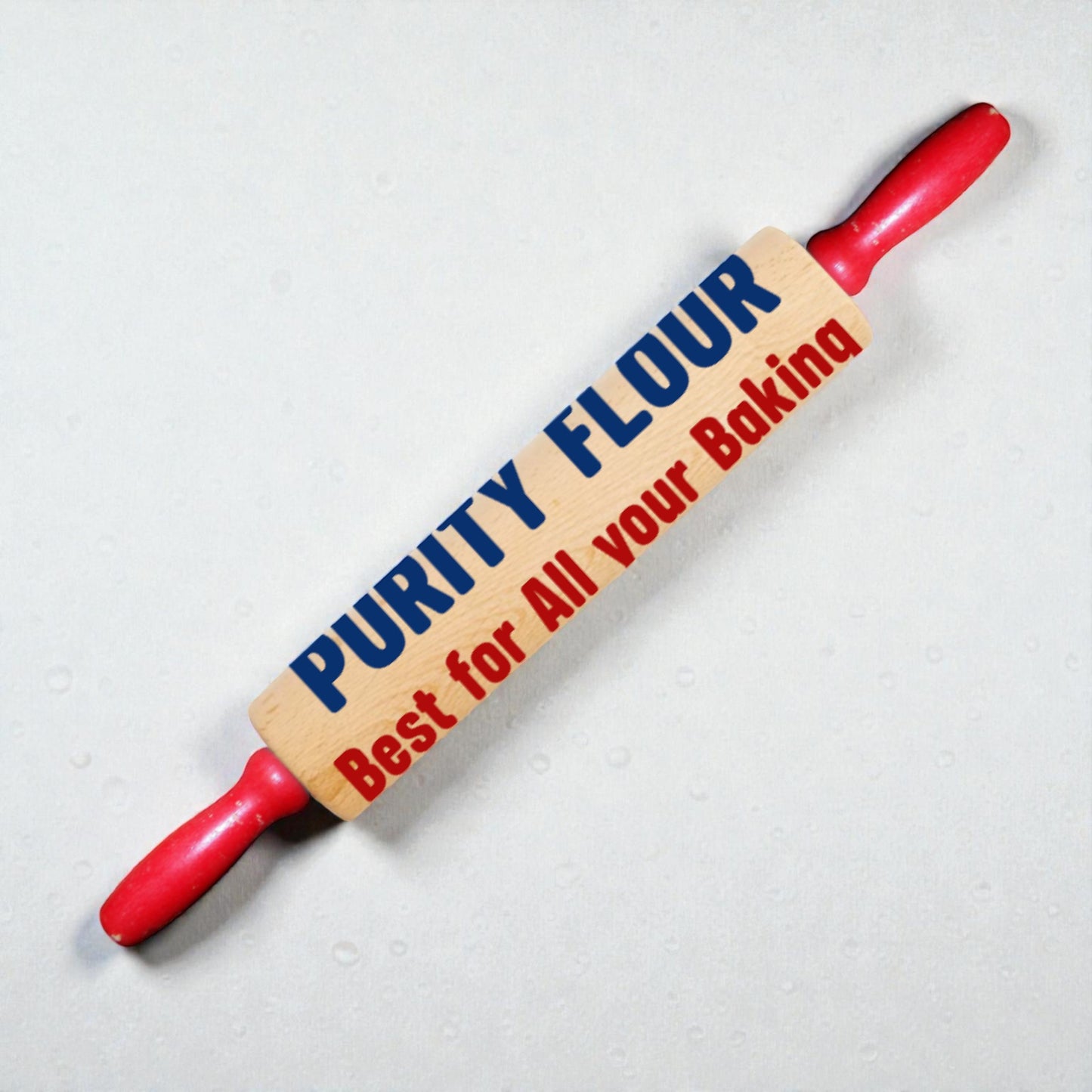 Rolling pin with 'Purity Flour' branding on a light background