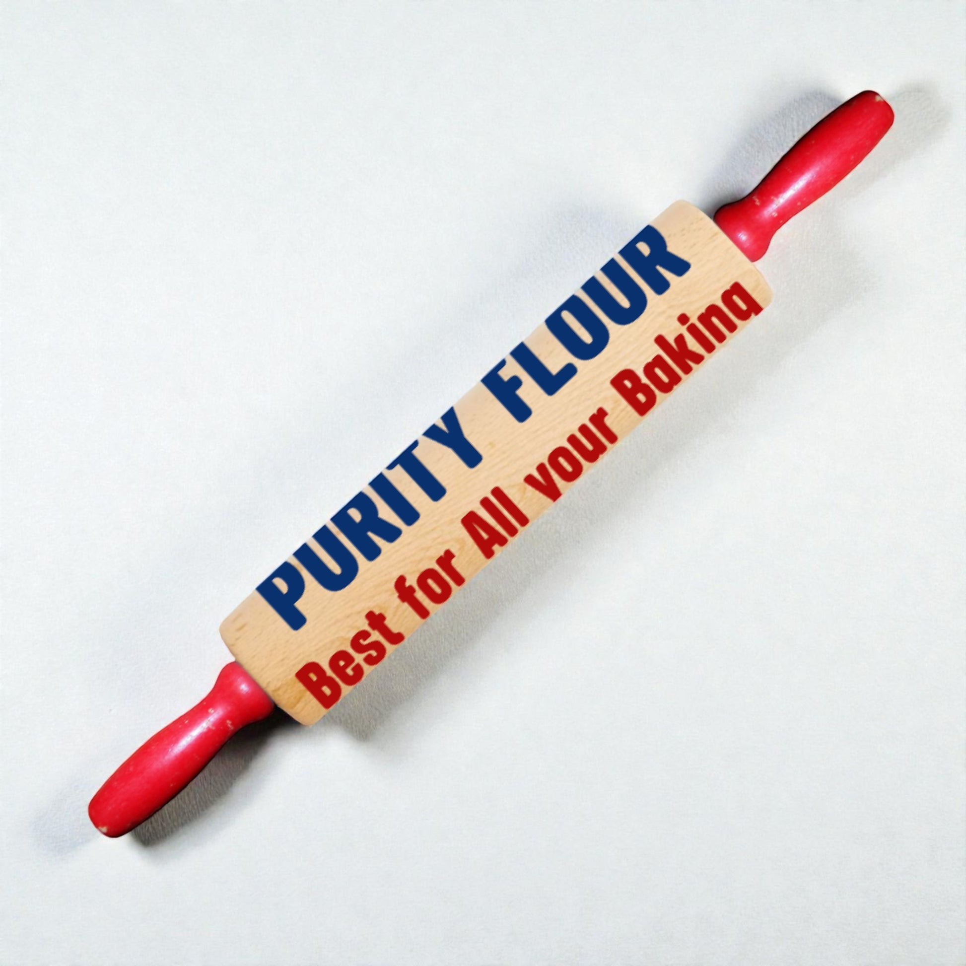Rolling pin with 'Purity Flour' branding on a white background