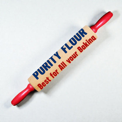 Rolling pin with 'Purity Flour' branding on a white background