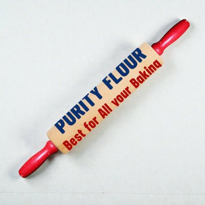 Rolling pin with 'Purity Flour' branding on a white background