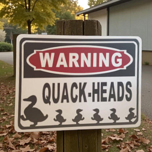 Warning sign with duck and ducklings illustration outdoors