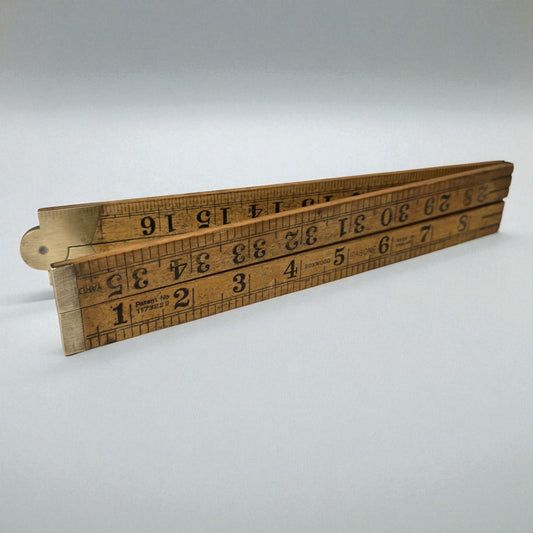 Wooden ruler with measurements on a white background