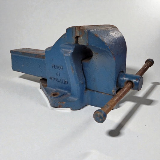 Blue metal vise on a white background