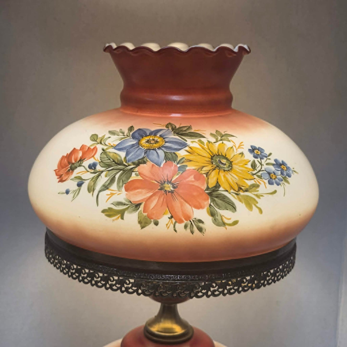 Vintage Gone with the Wind hurricane lamp with red and white floral glass and tri-light feature.
