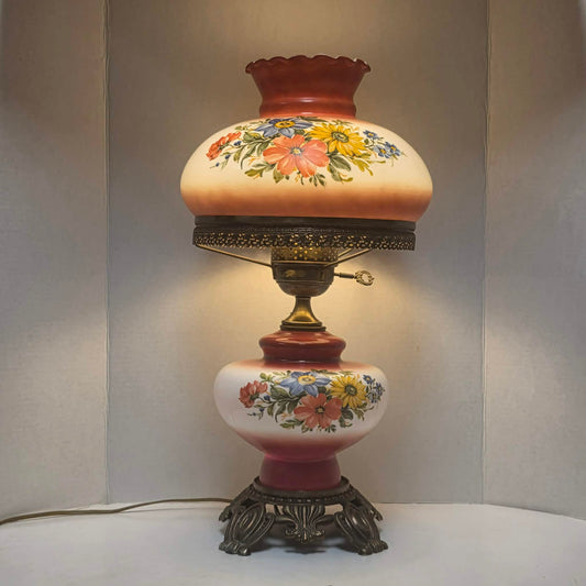 Vintage Gone with the Wind hurricane lamp with red and white floral glass and tri-light feature.
