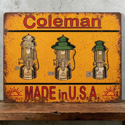 Rustic handmade Coleman Made in USA aluminum sign featuring three weathered Coleman lanterns.
