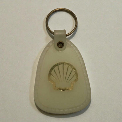 Shell logo keychain on a light gray background