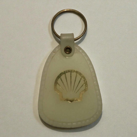 Shell logo keychain on a light gray background