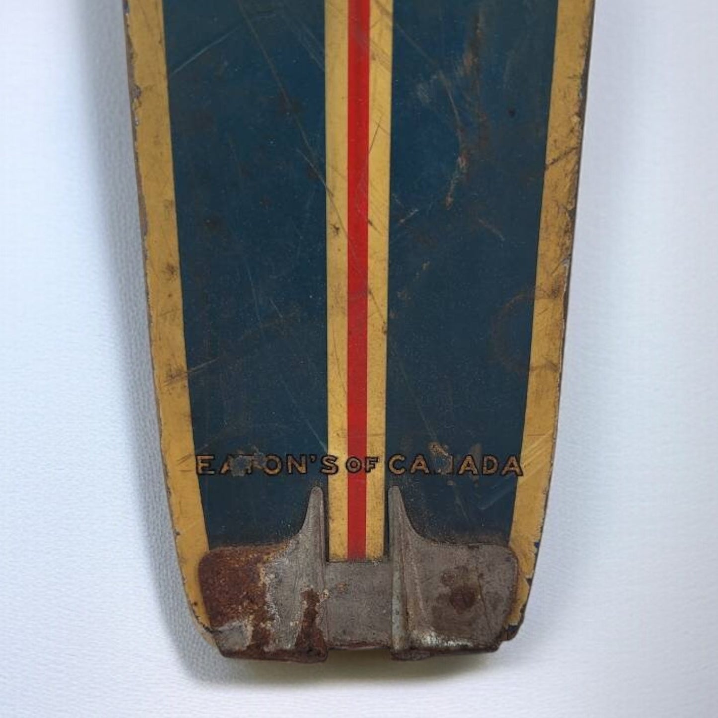 Vintage ski with 'Eaton's of Canada' branding on a white background