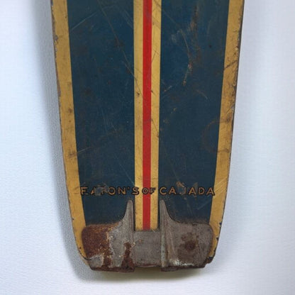 Vintage ski with 'Eaton's of Canada' branding on a white background