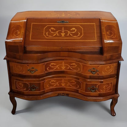Louis XVI-style inlaid marquetry writing desk with walnut and fruitwood, featuring drop-down surface and interior drawers.