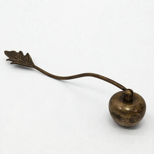 Bronze candle snuffer with a long handle on a white background