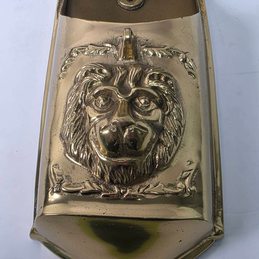 Vintage solid brass mailbox with ornate lion head front detail and dual access flaps.