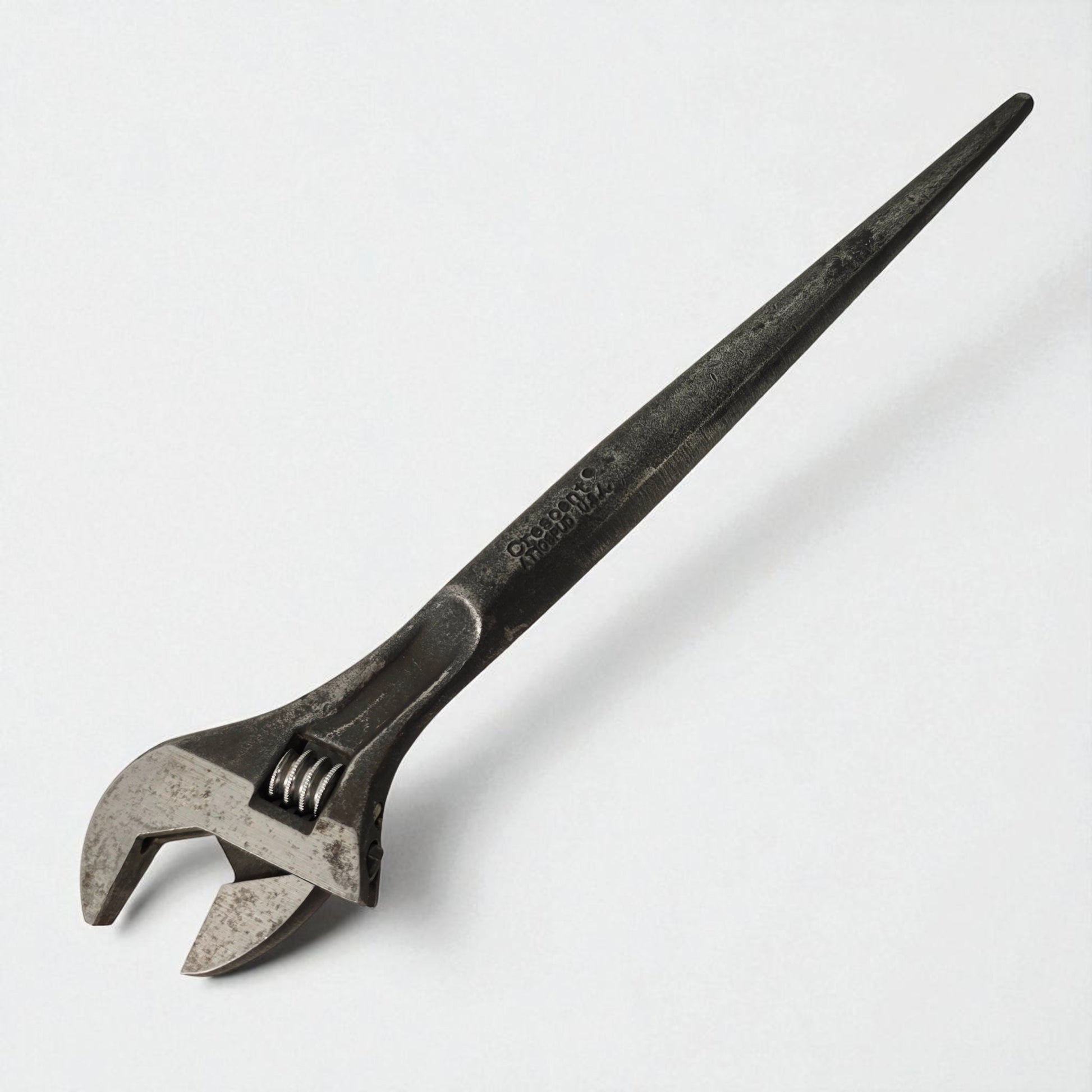 Vintage adjustable wrench on a white background