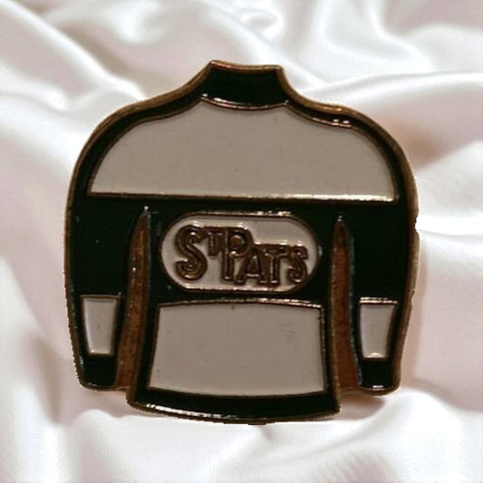 Pin with 'STP PATS' logo on a white background