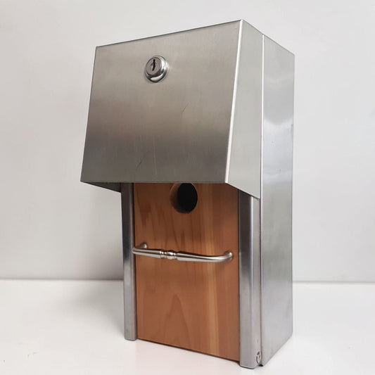 Handmade stainless steel birdhouse with sleek architectural styling and locking access door.