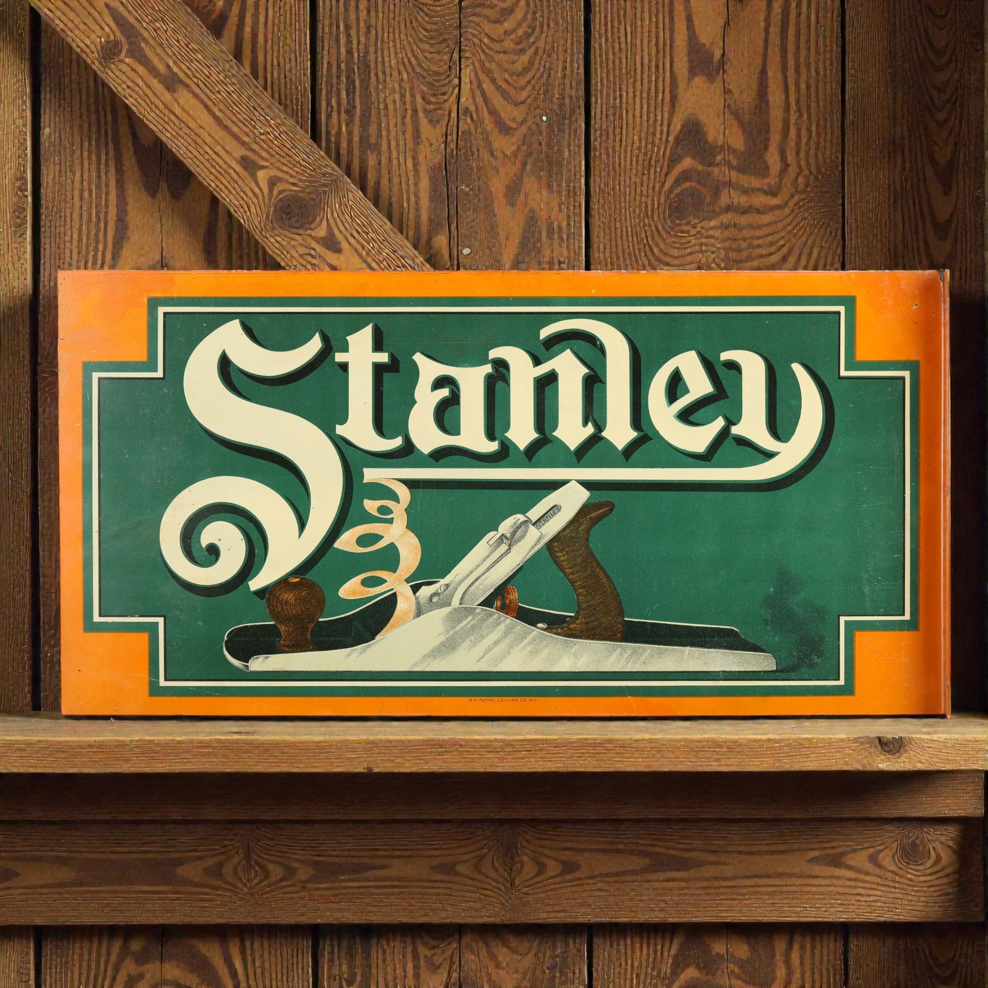 Stanley sign on a wooden surface with a wooden background