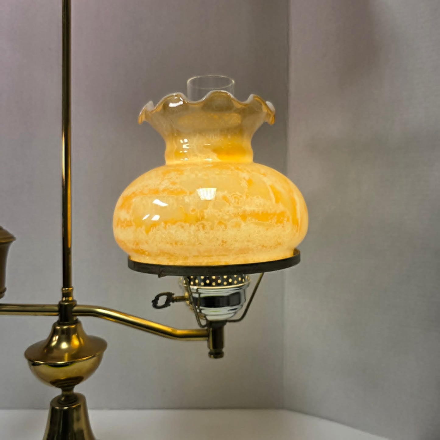 Vintage brass student lamp with hurricane-style shade, 25 inches tall.