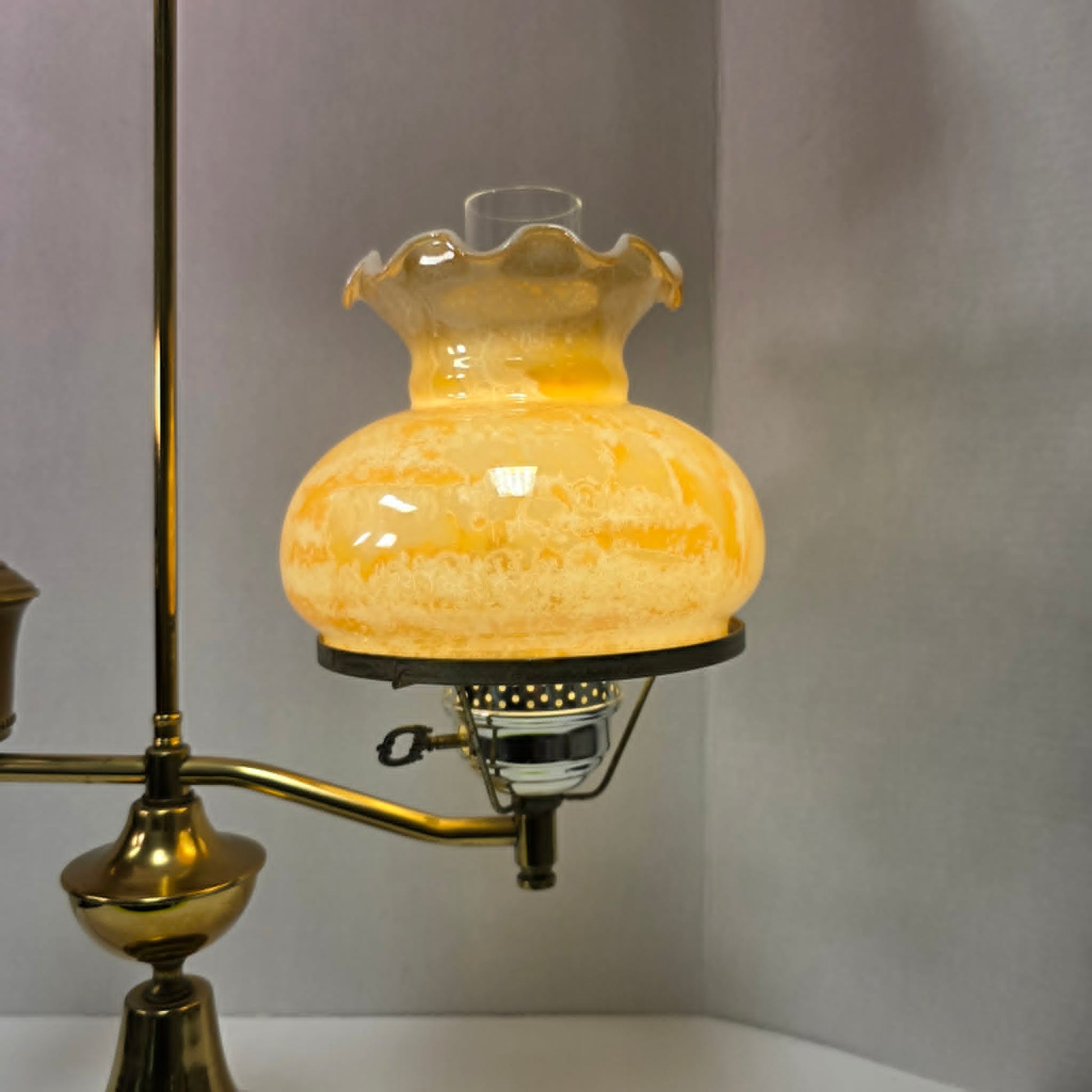 Vintage brass student lamp with hurricane-style shade, 25 inches tall.