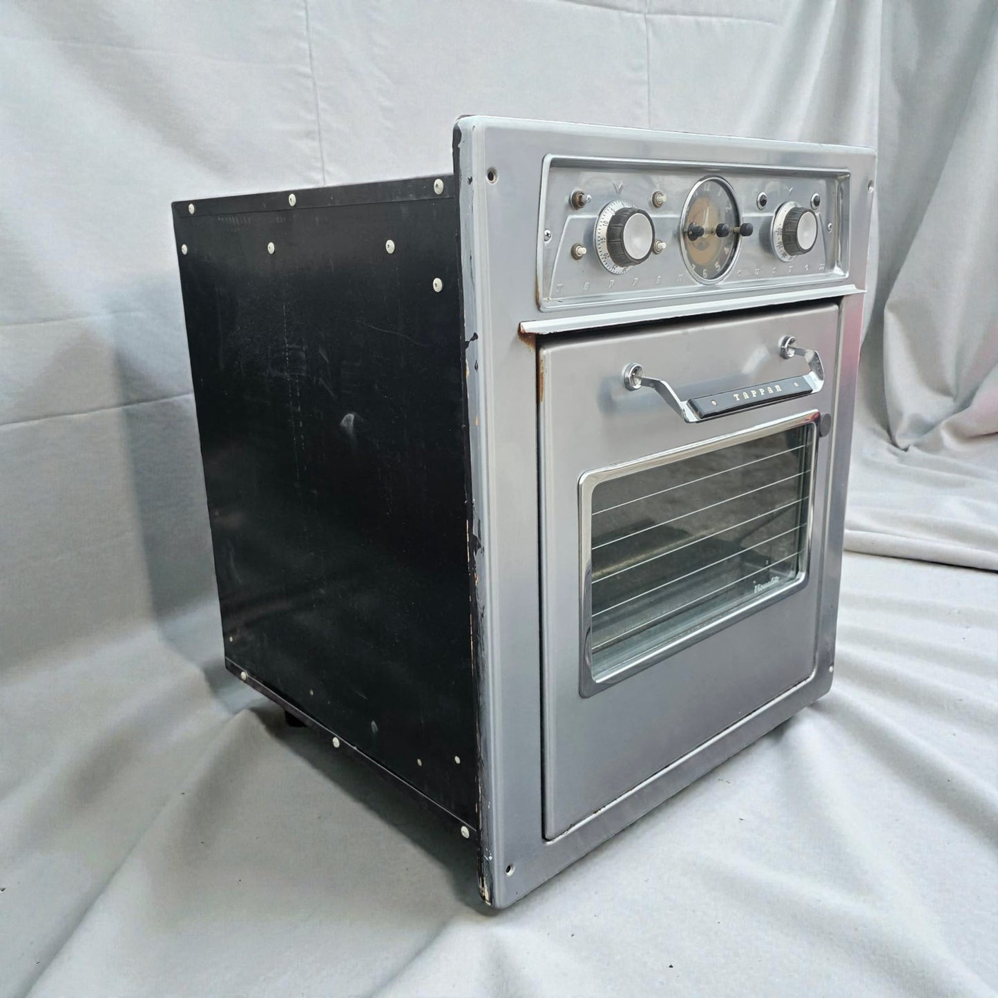 Small metal oven on a white background