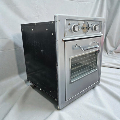 Small metal oven on a white background