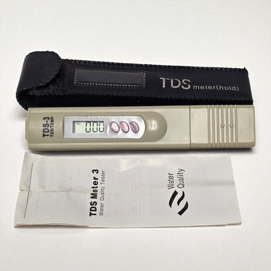 TDS meter with carrying case and manual on a white background