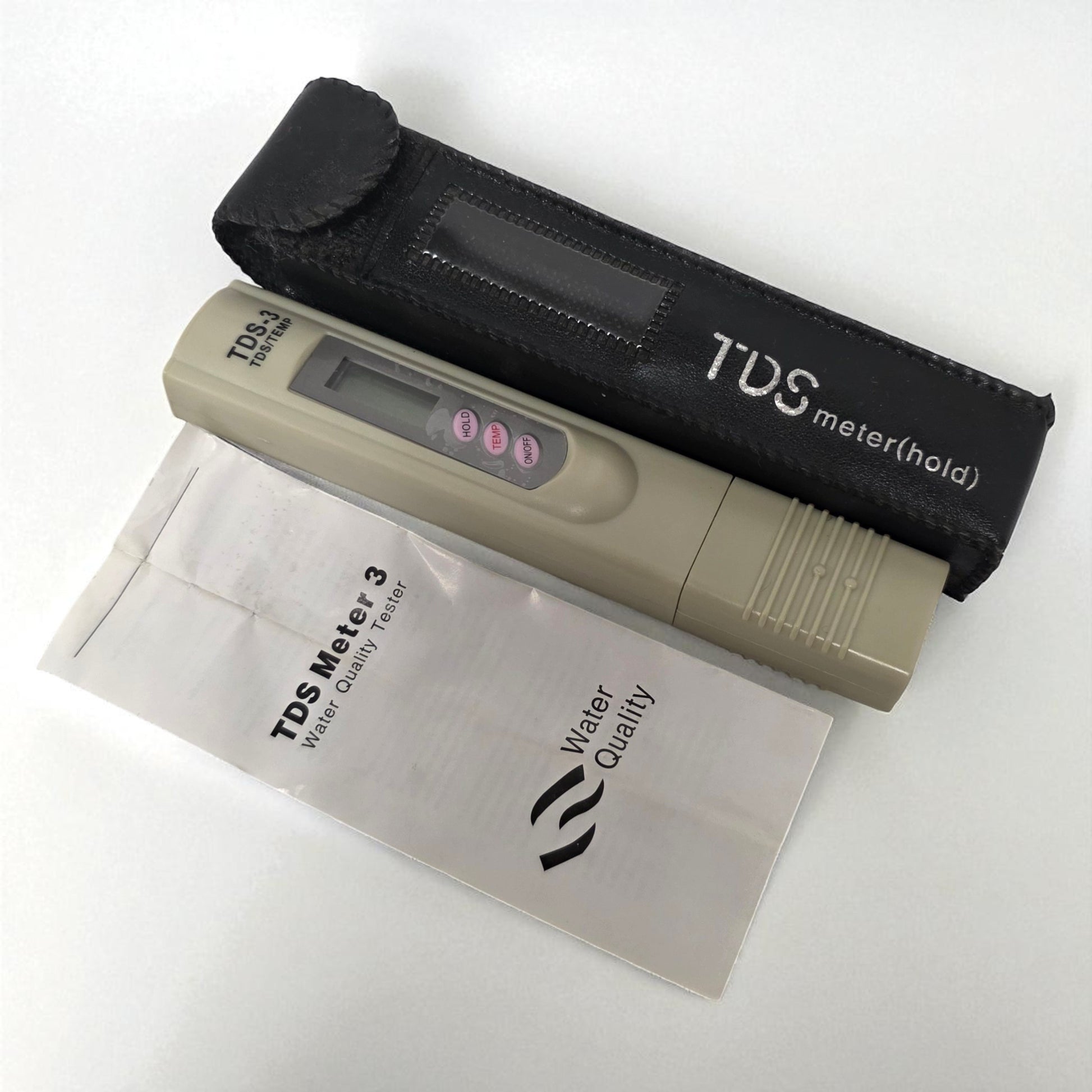 TDS meter with carrying case on a white background