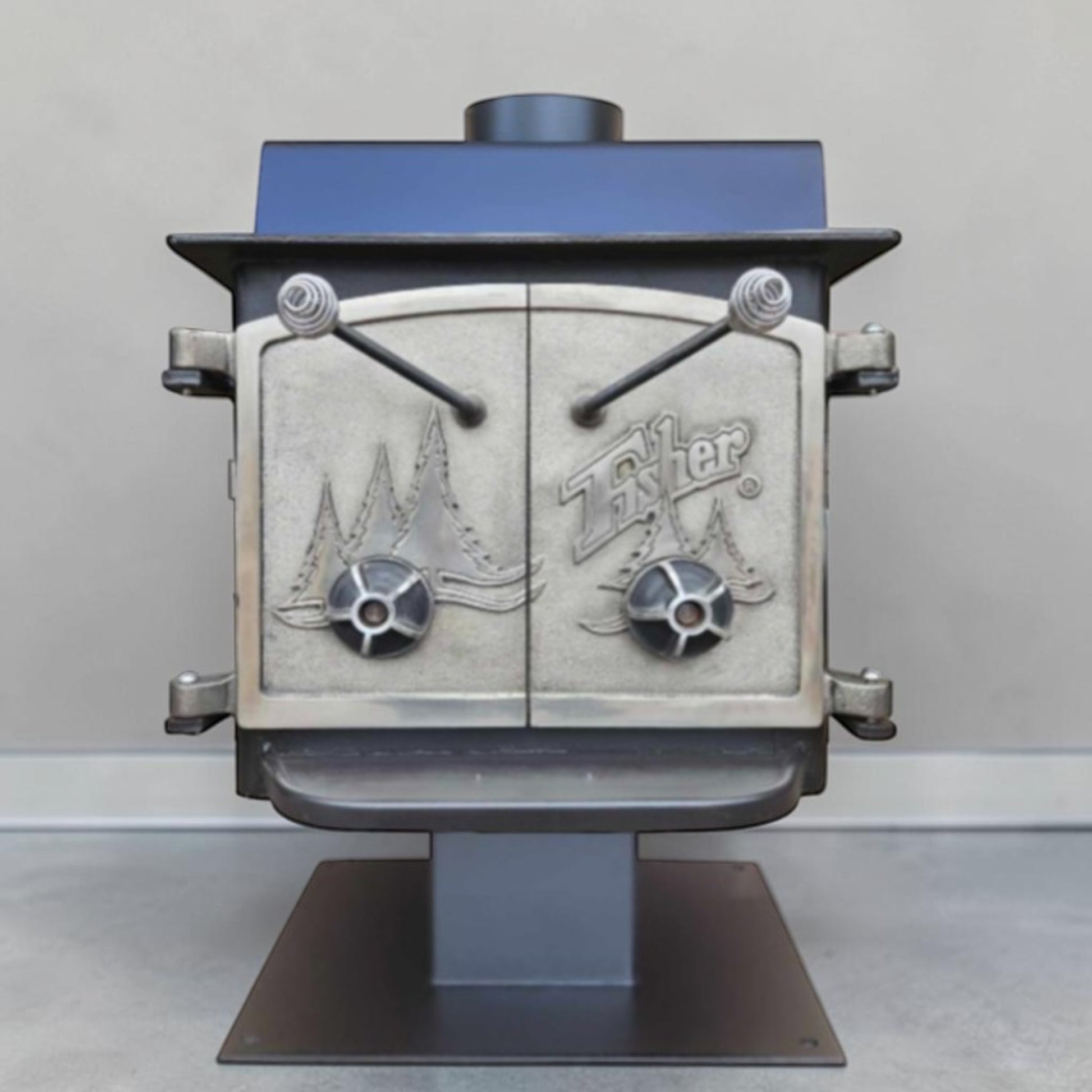 Vintage Fisher Teddy Bear wood stove with full factory nickel doors and pedestal base.
