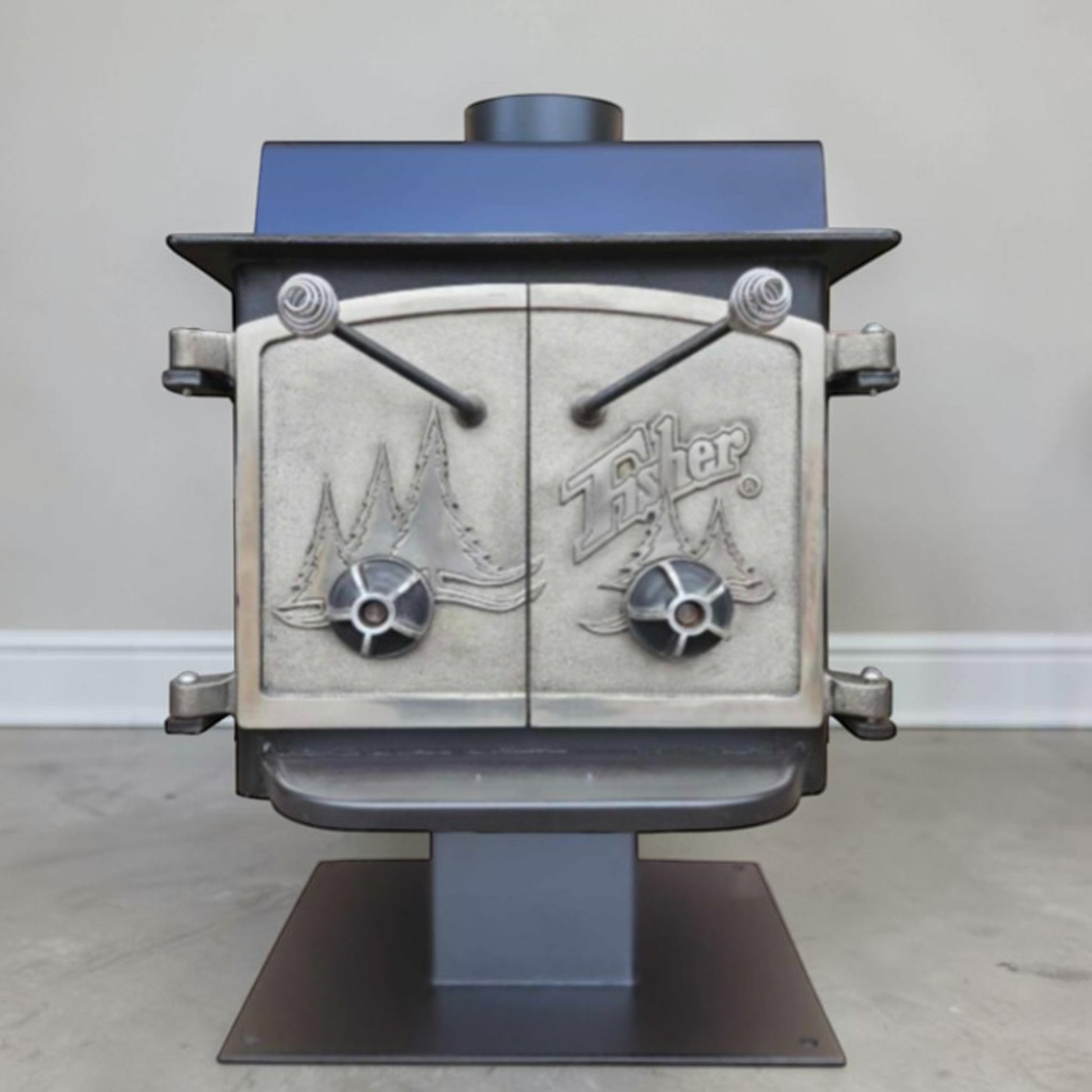 Vintage Fisher Teddy Bear wood stove with full factory nickel doors and pedestal base.

