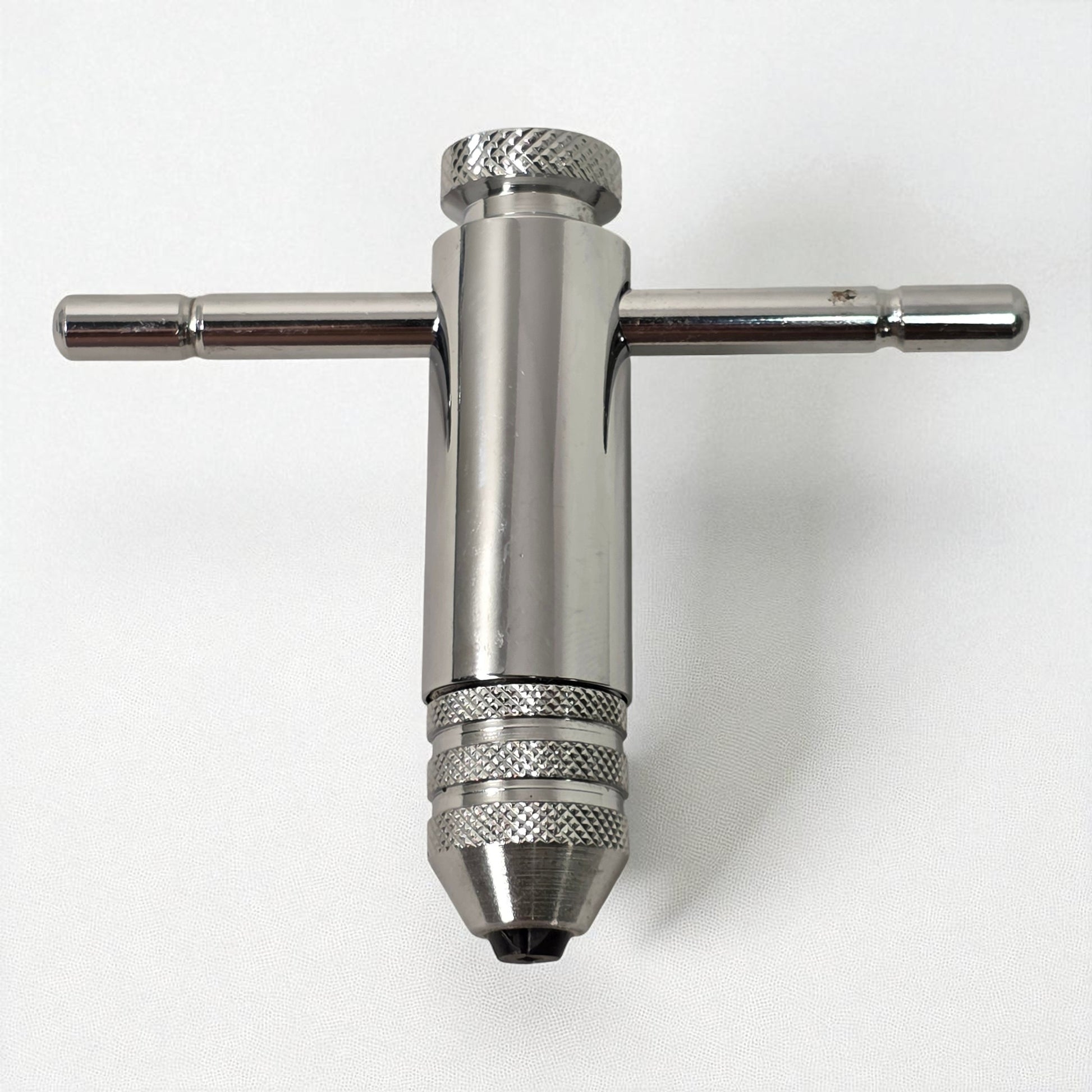 Metal drill bit holder on a white background