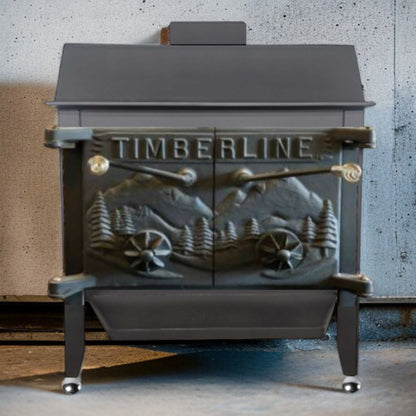 Wood stove with 'TIMBERLINE' branding and decorative design on a concrete wall background