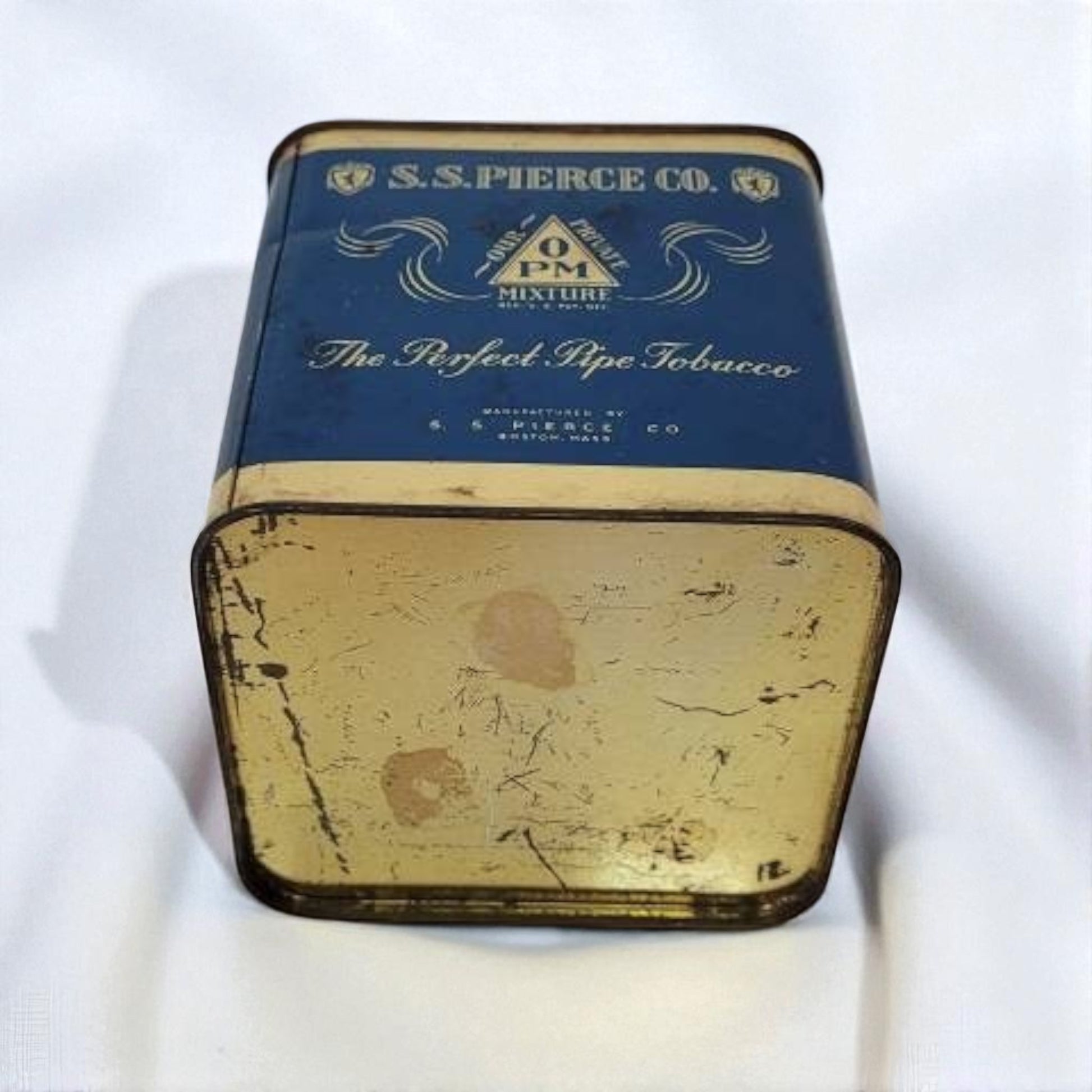 Vintage S.S. Pierce Co. tobacco tin on a white background