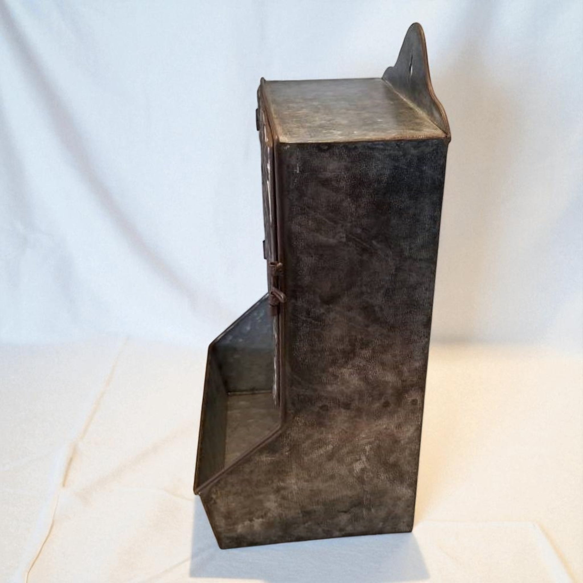 Metallic rectangular box with a hinged lid on a white background