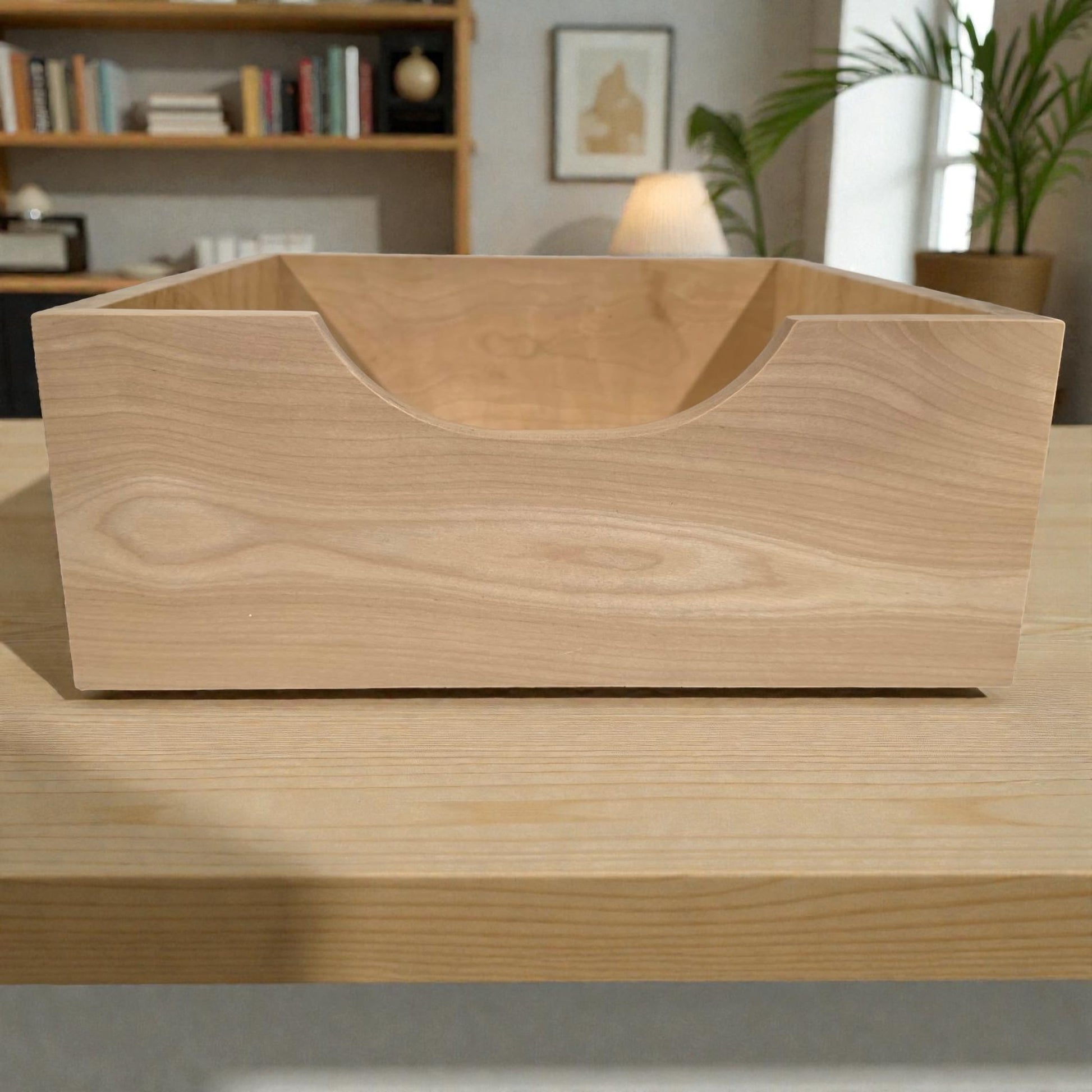Wooden desk organizer on a desk with a blurred background