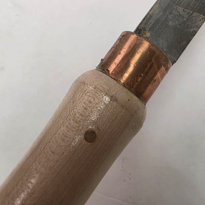 Custom-made thin woodturning parting chisel for precision detail work on a wood lathe.