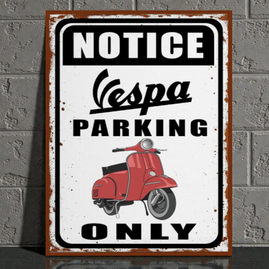 Vintage-style metal sign with Vespa scooter graphic and 'Notice Vespa Parking Only' text on a brick wall background.