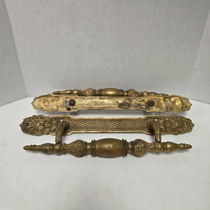 Pair of large Victorian brass bronze hotel door handles with butterfly design, crosshatched plates, and shell details. Antique architectural salvage hardware.