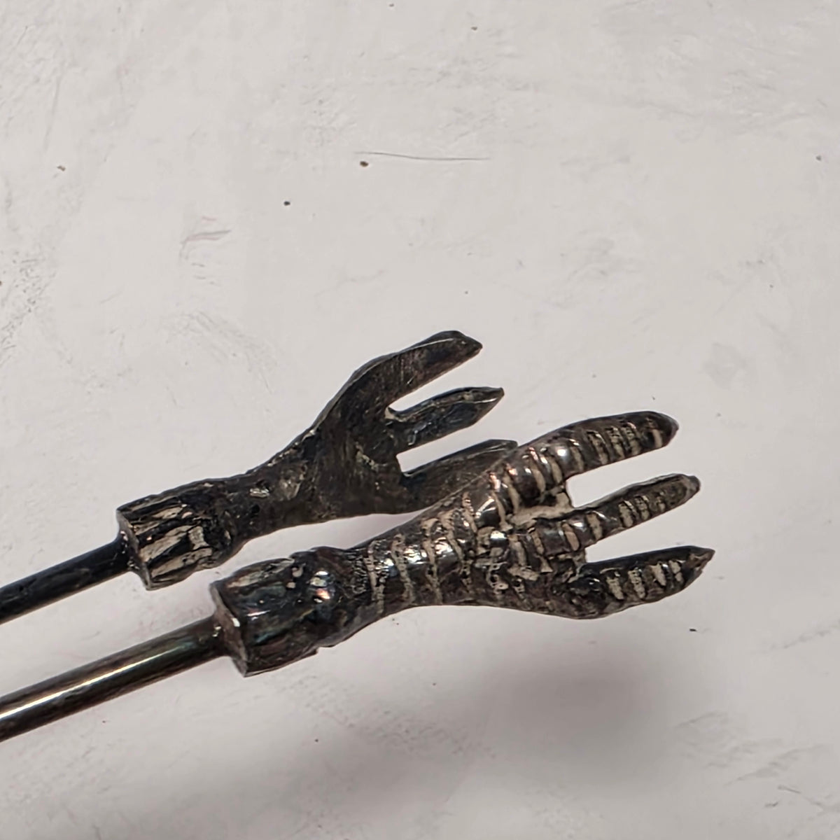 Victorian cranberry glass cruet with bird claw tongs
