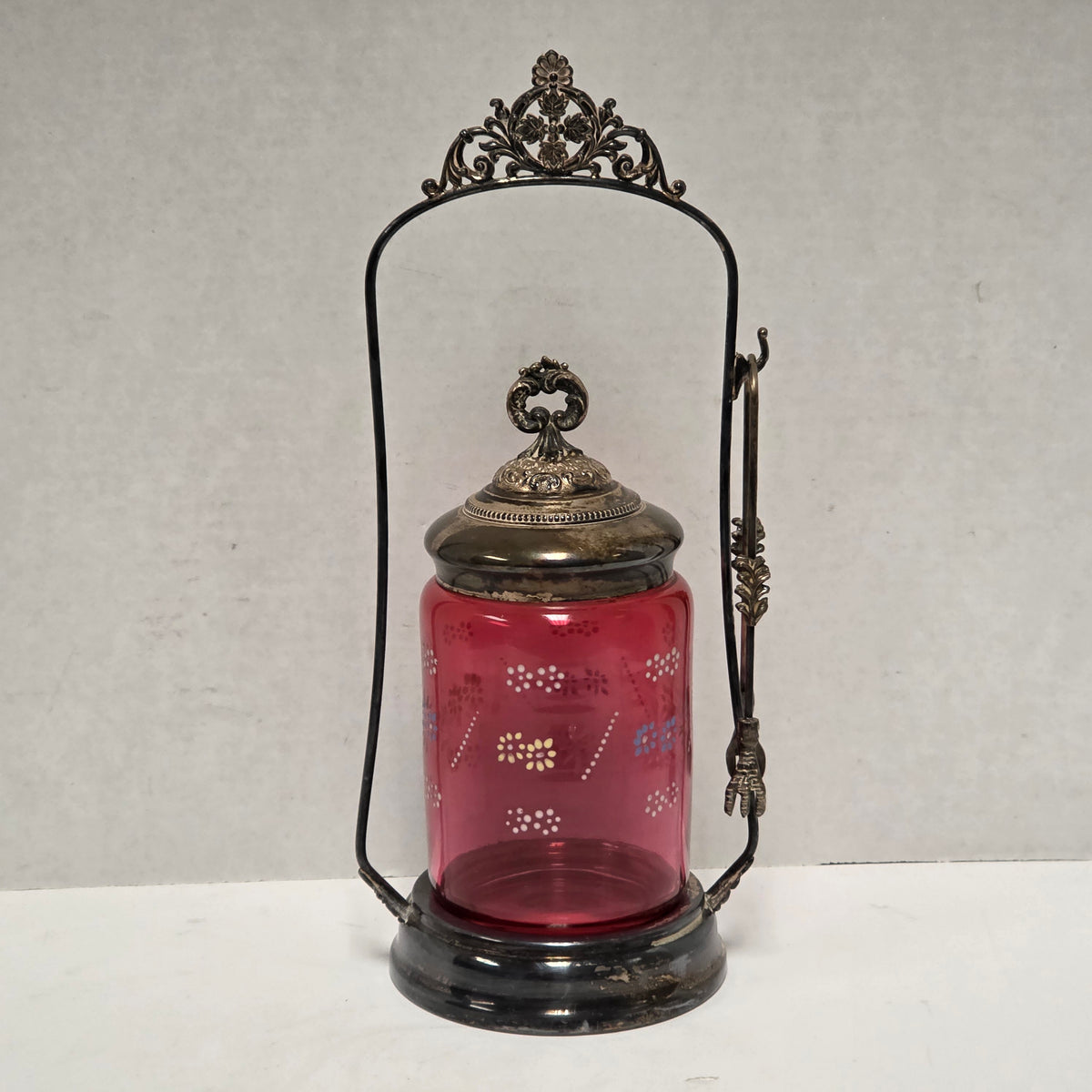 Victorian cranberry glass cruet with bird claw tongs
