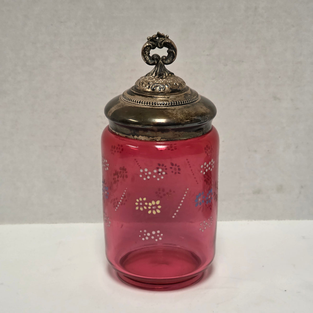 Victorian cranberry glass cruet with bird claw tongs
