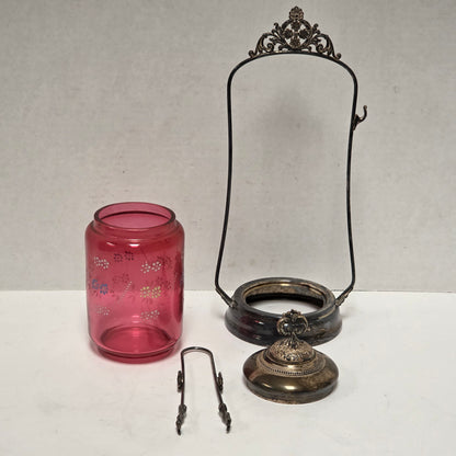 Victorian cranberry glass cruet with bird claw tongs
