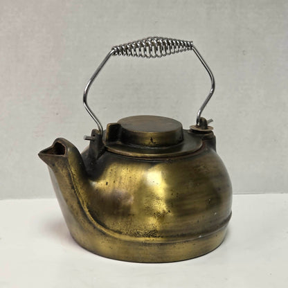 Vintage brass plated cast iron kettle with attached swivel lid for wood stove use.
