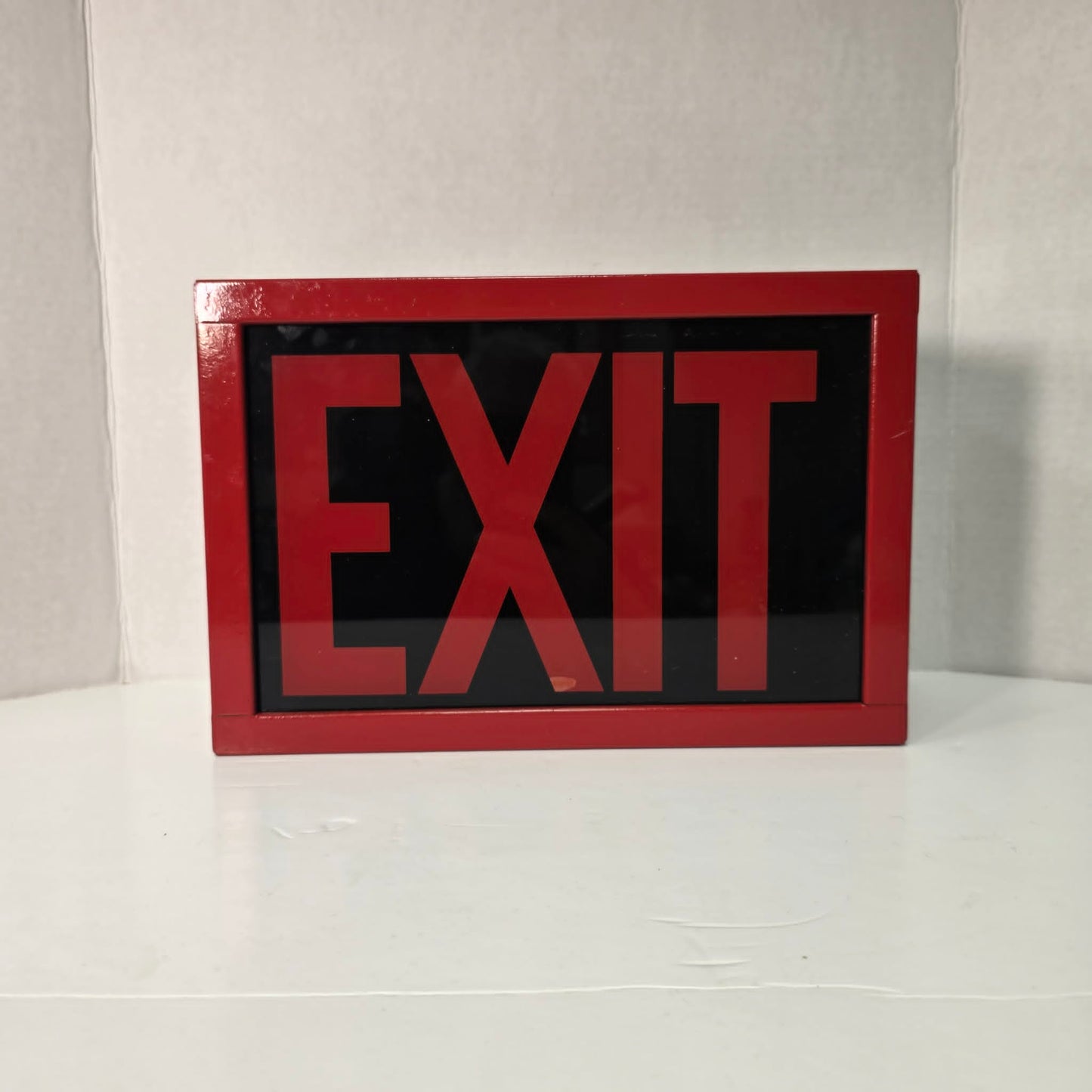 Functional vintage theater exit sign with original glass and toggle switch.