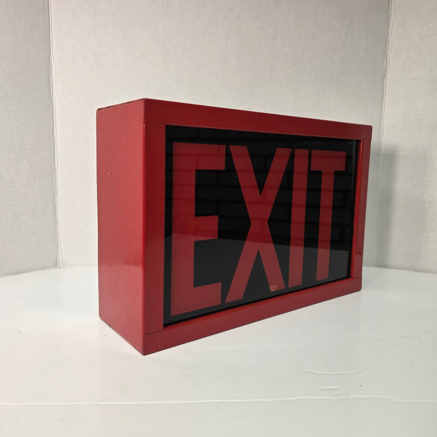 Functional vintage theater exit sign with original glass and toggle switch.