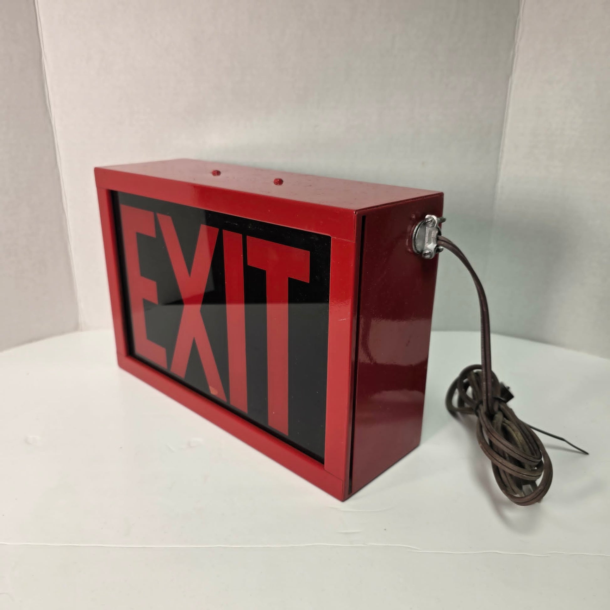 Functional vintage theater exit sign with original glass and toggle switch.