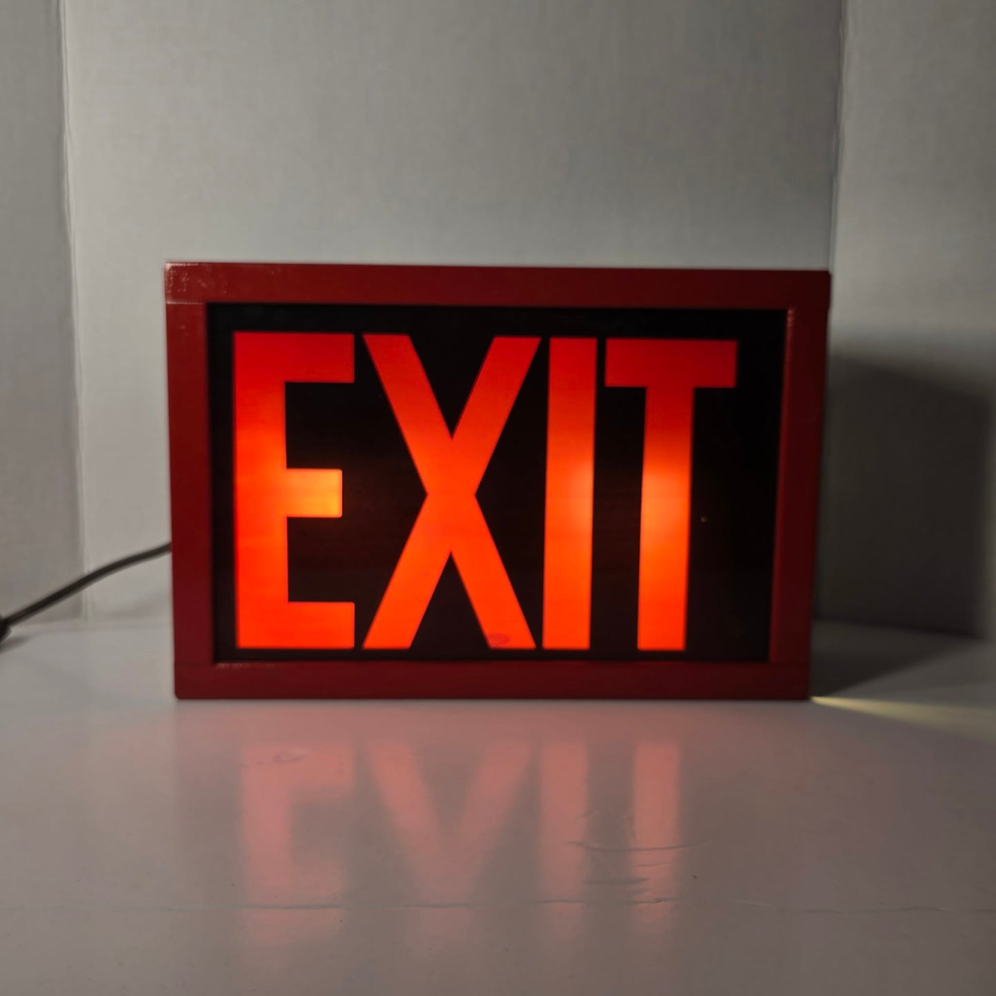 Functional vintage theater exit sign with original glass and toggle switch.