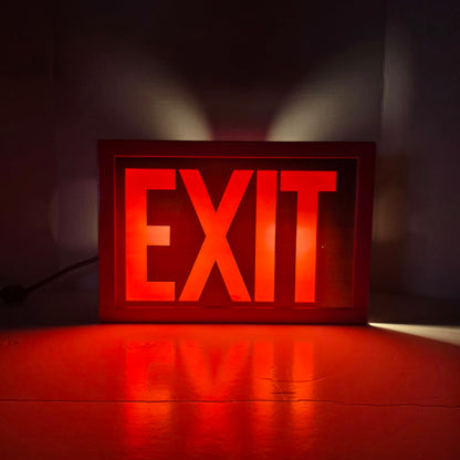 Functional vintage theater exit sign with original glass and toggle switch.